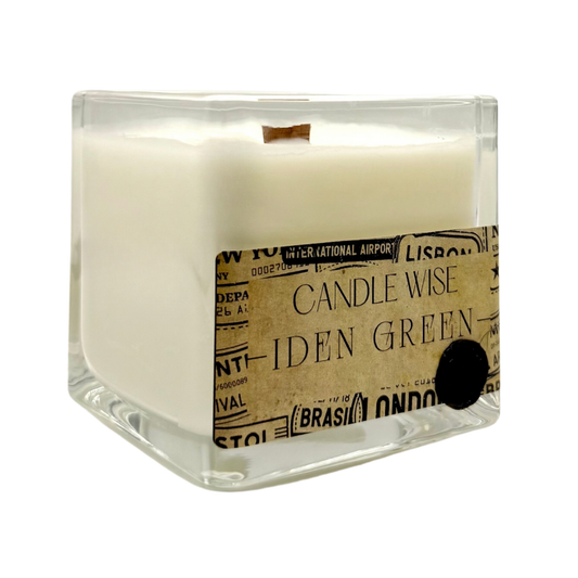 Angled view of Candle Wise Iden Green large square glass candle showing coconut wax and wooden wick