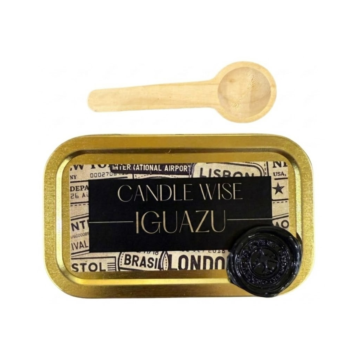 A top down close up of a gold tin filled with white scoopable wax melt lightly sprinkled with green jasmine tea leaves and a small wooden spoon resting in the wax