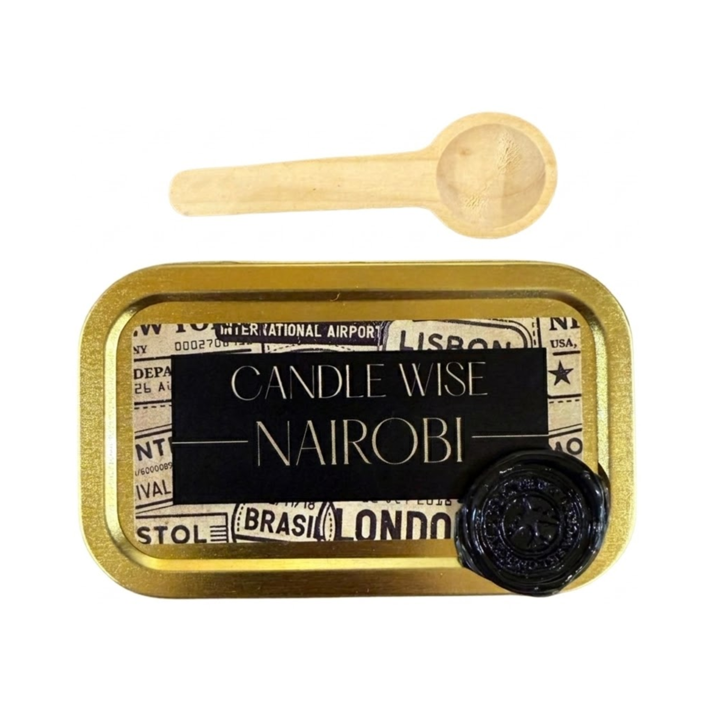 A top down view of a gold rectangular tin with a black and vintage travel themed label. The label features the text Candle Wise NAIROBI in capital letters and a black wax seal. A small wooden scoop is placed above the tin.