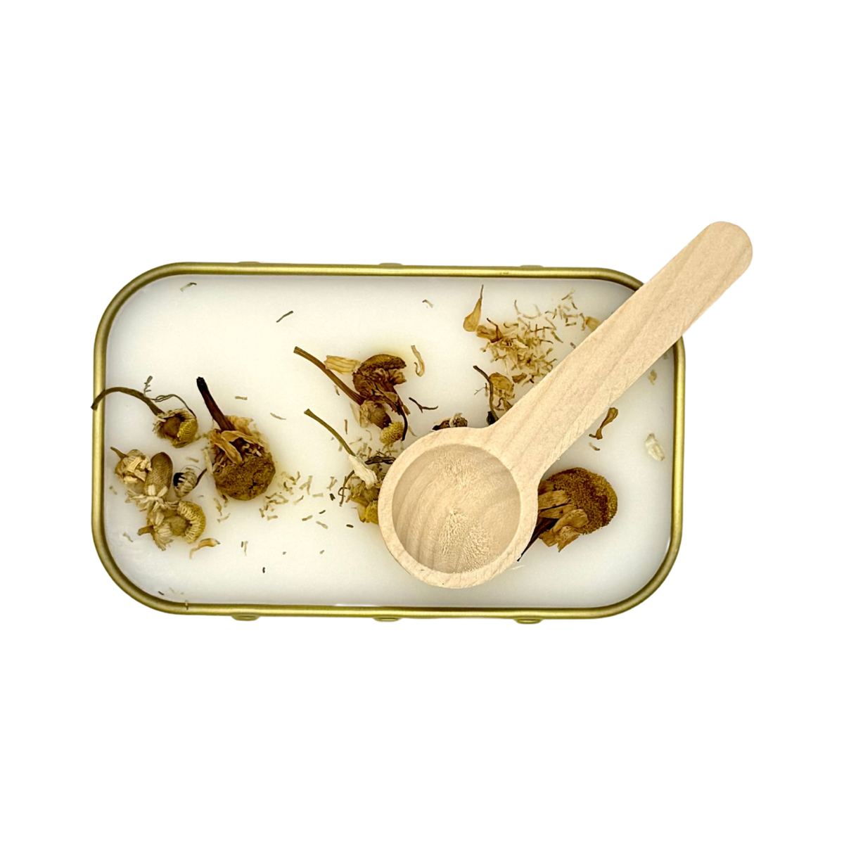Overhead view of Candle Wise Benenden scoopable wax melt showing chamomile botanical toppings and wooden spoon