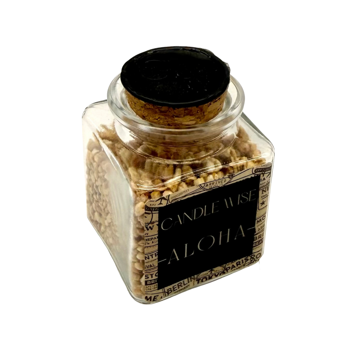 Angled top view of CANDLE WISE Aloha open jar drawer diffuser showing the natural cork stopper with stamped wax seal and filled corn cob granules.