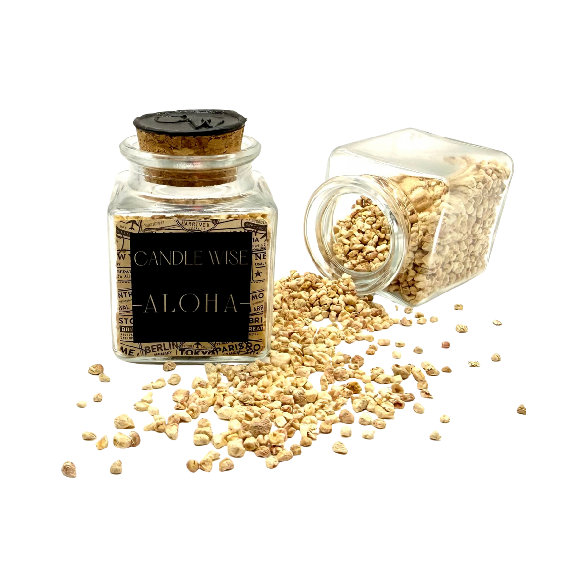 CANDLE WISE Aloha drawer diffuser glass jar standing beside an open tilted jar with scented corn cob granules spilling onto a clean background.