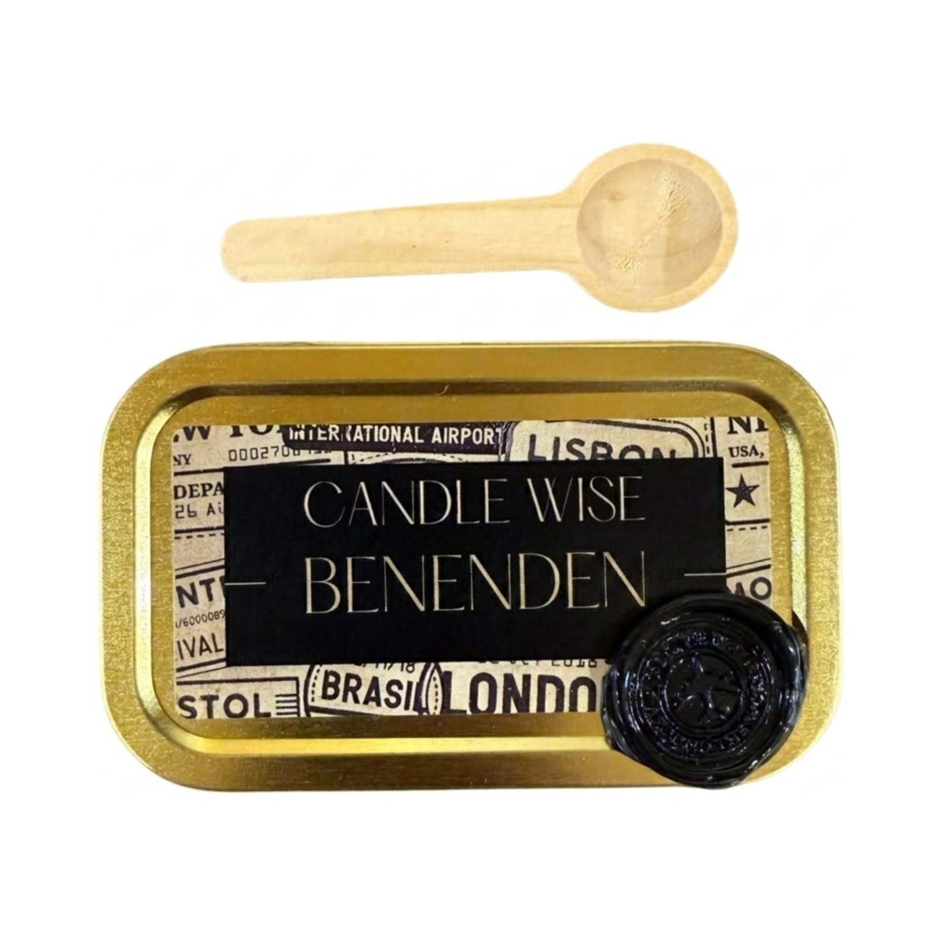 A top down view of a gold rectangular tin with a black and vintage travel themed label. The label features the text Candle Wise BENENDEN in capital letters and a black wax seal. A small wooden scoop is placed above the tin.