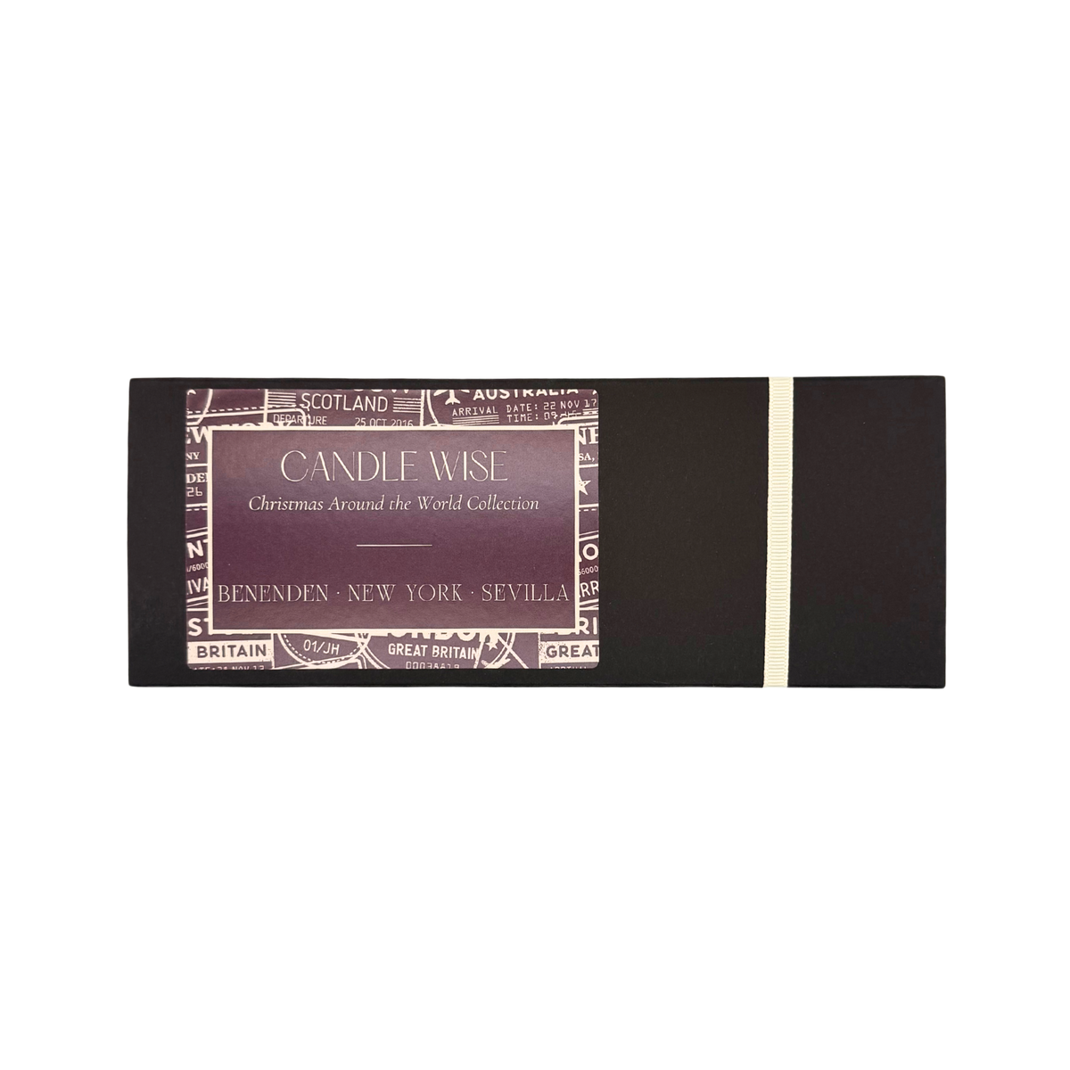 Candle Wise Christmas Around the World Trio Candle Gift Set in a closed black presentation box with ribbon detail