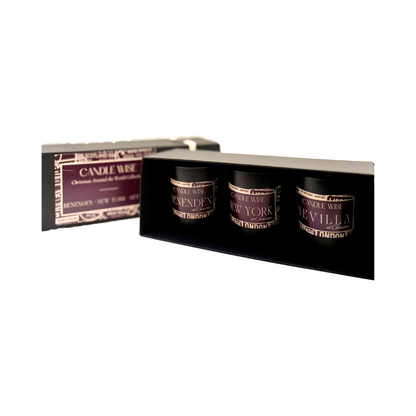 Candle Wise Christmas Around the World Trio Candle Gift Set displaying three candles inside an open luxury presentation box
