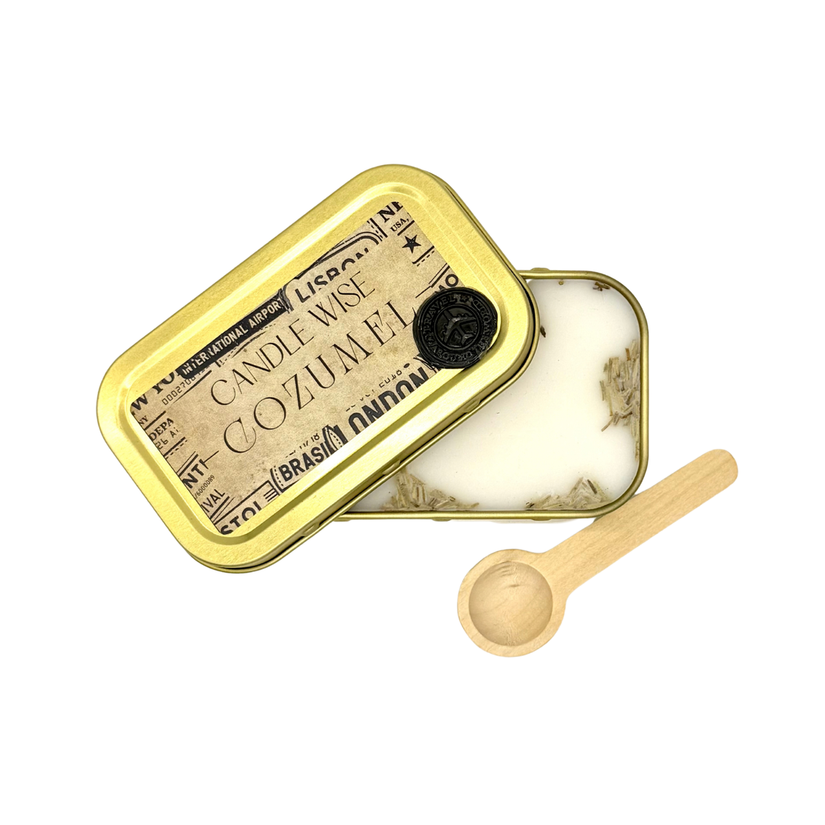 Candle Wise Cozumel scoopable wax melt open gold tin showing dried botanicals alongside lid and wooden spoon