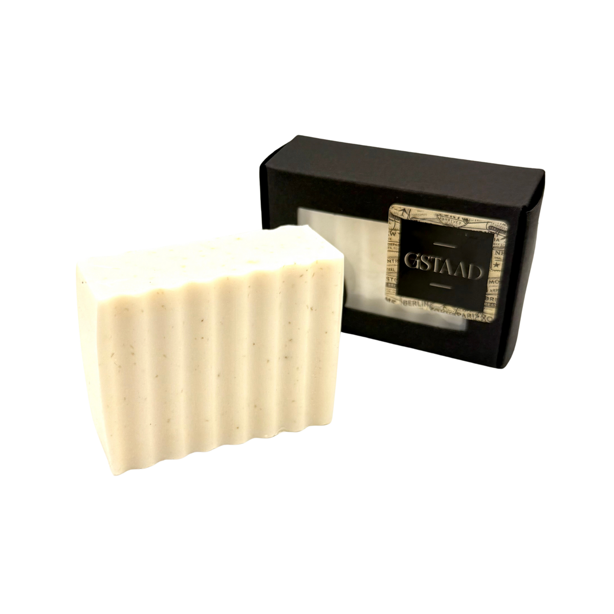 Candle Wise Gstaad textured artisan soap bar displayed alongside its black presentation box.