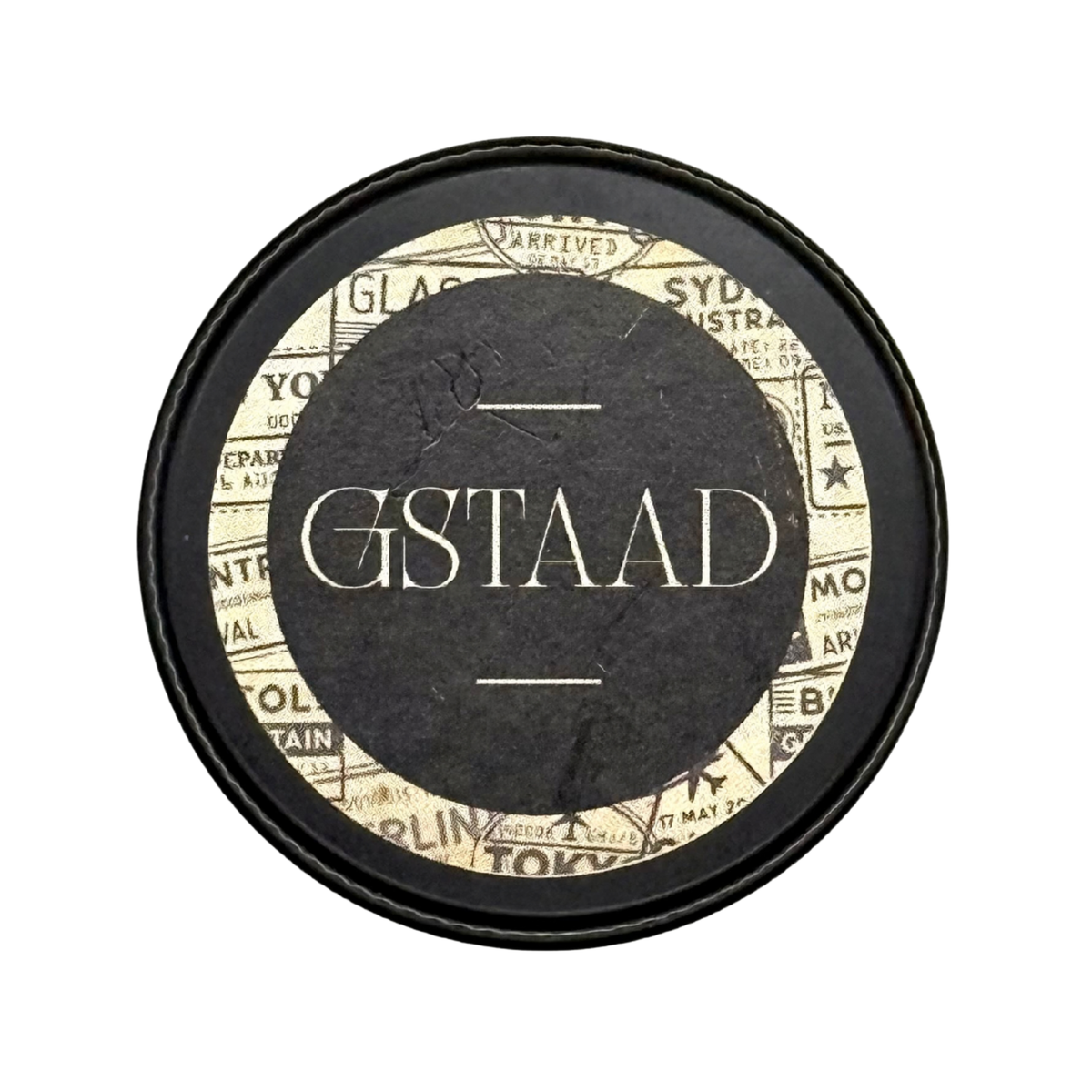 Candle Wise Gstaad solid perfume closed black tin lid featuring vintage travel label.