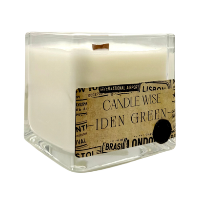 Angled view of Candle Wise Iden Green large square glass candle showing coconut wax and wooden wick
