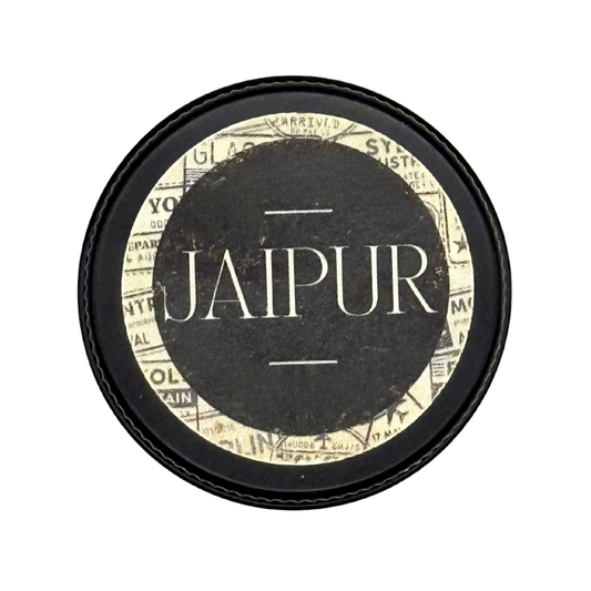 Candle Wise Jaipur solid perfume closed black tin lid with destination travel label.