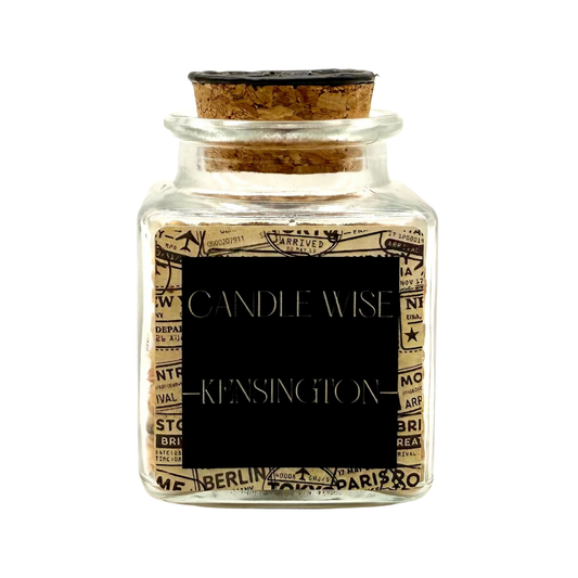 CANDLE WISE Kensington scented corn cob granule drawer diffuser in a square glass jar with a cork stopper and black wax seal, front view.