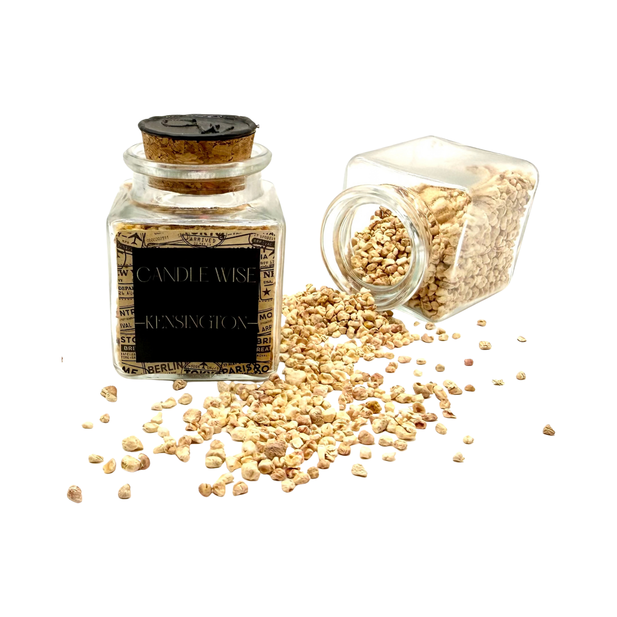CANDLE WISE Kensington drawer diffuser glass jar standing beside an open tilted jar with scented corn cob granules spilling onto a clean background.
