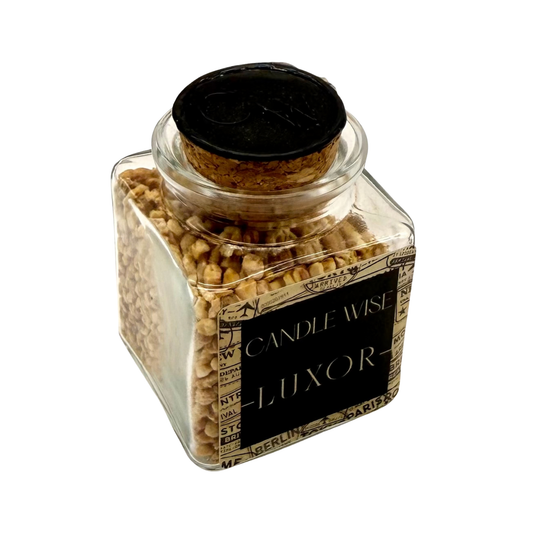 Angled top view of CANDLE WISE Luxor open jar drawer diffuser showing the natural cork stopper with stamped wax seal and filled corn cob granules.