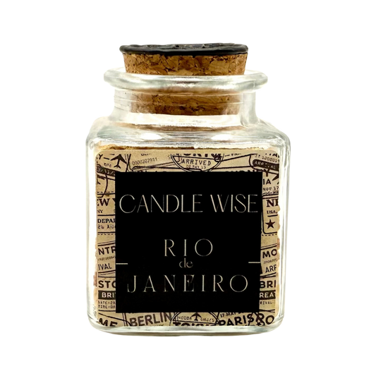 CANDLE WISE Rio scented corn cob granule drawer diffuser in a square glass jar with a cork stopper and black wax seal, front view.